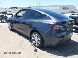 2024 Tesla Model Y with VIN 7SAYGDED2RF040745, listed as a IAAI auction lot 41986613 with 9,778 mi miles and . Bid and sale history available at DreamBid. Image 3.