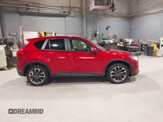 2016 Mazda CX-5 Grand Touring with VIN JM3KE4DY6G0690923, listed as a IAAI auction lot 41875553 with 179,489 mi miles. Bid and sale history available at carsss.com. Image 13.