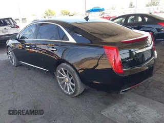 2013 Cadillac XTS Luxury with VIN 2G61P5S35D9105460, listed as a IAAI auction lot 42582313 with 144,895 mi miles and . Bid and sale history available at DreamBid. Image 3.