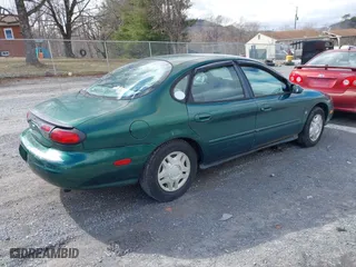 1999 Ford Taurus SE with VIN 1FAFP53S5XA102534, listed as a IAAI auction lot 41740212 with 154,926 mi miles. Bid and sale history available at carsss.com. Image 4.