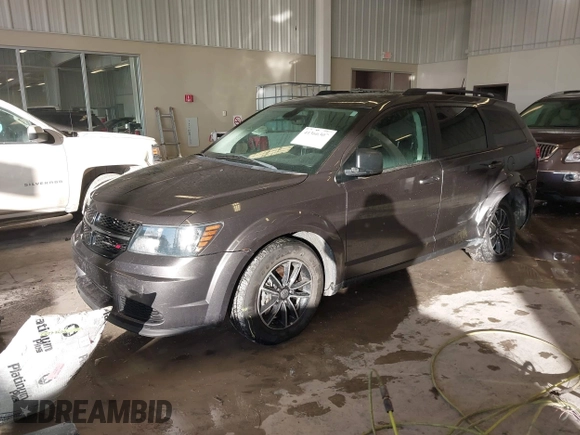 2018 Dodge Journey SE with VIN 3C4PDCAB1JT519745, listed as a IAAI auction lot 41366307 with 131,436 mi miles. Bid and sale history available at carsss.com. Image 2.