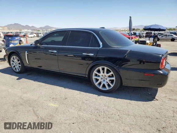 2009 Jaguar XJ 8 with VIN SAJWA71B79SH30431, listed as a Copart auction lot 52403185 with 67,143 mi miles and Salvage Title. Bid and sale history available at DreamBid. Image 2.