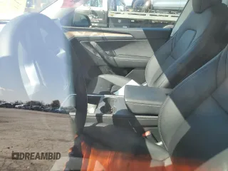 2023 Tesla Model Y Performance z VIN 7SAYGDEF9PF865129, wystawiony jako Copart lot #50228735 z przebiegiem Nie podano mil oraz Szkoda całkowita • Salvage title. Historia ofert i sprzedaży dostępna na DreamBid. Obrazek 7.