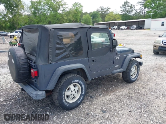 2002 Jeep Wrangler X with VIN 1J4FA39S92P736825, listed as a IAAI auction lot 42156410 with 196,313 mi miles. Bid and sale history available at carsss.com. Image 4.