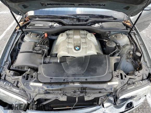 2005 BMW 7 Series 745i z VIN WBAGL63565DP76324, wystawiony jako Copart lot #45037385 z przebiegiem 52 771 mil mil oraz Szkoda całkowita • Salvage title. Historia ofert i sprzedaży dostępna na DreamBid. Obrazek 11.
