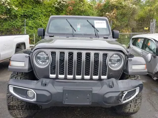 2021 Jeep Wrangler Unlimited Sahara with VIN 1C4JJXP60MW704738, listed as a IAAI auction lot 42042079 with 63,765 mi miles and . Bid and sale history available at DreamBid. Image 12.