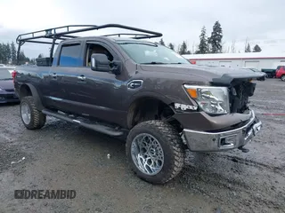 2016 Nissan Titan SL z VIN 1N6BA1F2XGN512329, wystawiony jako IAAI lot #41482464 z przebiegiem 82 172 mil mil oraz . Historia ofert i sprzedaży dostępna na DreamBid. Obrazek 1.
