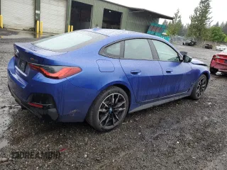 2023 BMW i4 M50 with VIN WBY33AW07PFN69788, listed as a Copart auction lot 54684024 with 14,193 mi miles. Bid and sale history available at carsss.com. Image 3.
