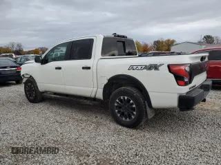 2023 Nissan Titan SV z VIN 1N6AA1ED7PN116504, wystawiony jako Copart lot #77986734 z przebiegiem 31 392 mil mil oraz Szkoda całkowita • Salvage title. Historia ofert i sprzedaży dostępna na DreamBid. Obrazek 2.