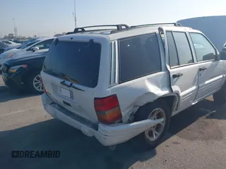 1998 Jeep Grand Cherokee with VIN 1J4FX78S2WC281501, listed as a IAAI auction lot 42140170 with 177,575 mi miles and . Bid and sale history available at DreamBid. Image 6.