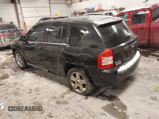 2010 Jeep Compass Sport with VIN 1J4NF4FB0AD501897, listed as a IAAI auction lot 41570009 with 198,376 mi miles. Bid and sale history available at carsss.com. Image 3.