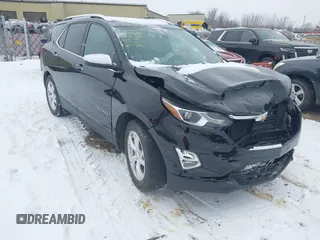 2021 Chevrolet Equinox Premier z VIN 2GNAXNEV9M6150369, wystawiony jako IAAI lot #41315549 z przebiegiem 57 614 mil mil oraz . Historia ofert i sprzedaży dostępna na DreamBid. Obrazek 1.