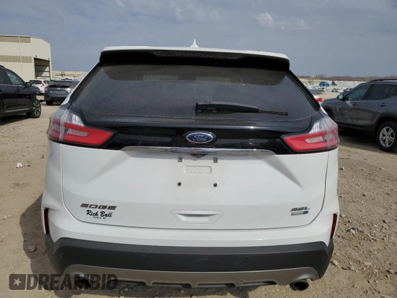 2020 Ford Edge SEL с VIN 2FMPK4J91LBA69663, выставлен на аукционе Copart как лот 50611005 с пробегом 61 534 миль миль и Списание • Salvage title. История ставок и продаж доступна на DreamBid. Изображение 6.
