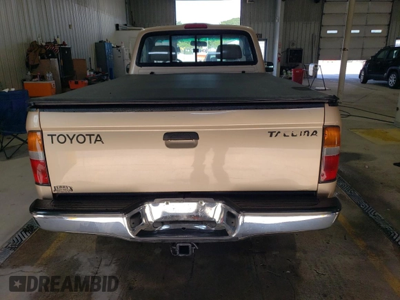 1998 Toyota Tacoma with VIN 4TAPM62N3WZ121359, listed as a Copart auction lot 63473485 with 133,472 mi miles and Salvage title. Bid and sale history available at DreamBid. Image 6.