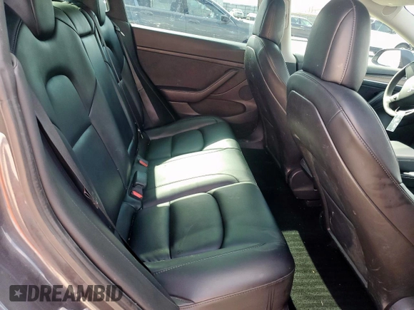 2021 Tesla Model 3 Standard Range Plus z VIN 5YJ3E1EA6MF082796, wystawiony jako Copart lot #53110955 z przebiegiem 92 009 mil mil oraz Szkoda całkowita • Salvage title. Historia ofert i sprzedaży dostępna na DreamBid. Obrazek 10.