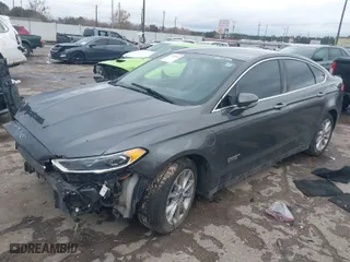 2017 Ford Fusion Energi SE with VIN 3FA6P0PU4HR306053, listed as a IAAI auction lot 41294944 with 88,603 mi miles. Bid and sale history available at carsss.com. Image 2.