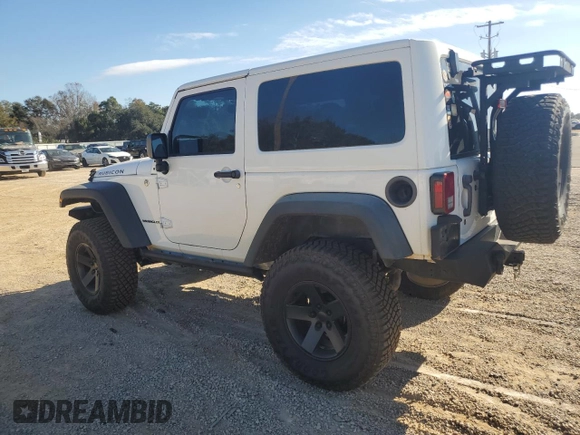 2013 Jeep Wrangler Rubicon with VIN 1C4BJWCG3DL590006, listed as a Copart auction lot 85855594 with 99,218 mi miles and Salvage title. Bid and sale history available at DreamBid. Image 2.