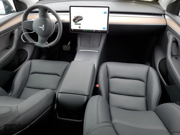 2025 Tesla Model Y Long Range with VIN 7SAYGDED4SF242721, listed as a Copart auction lot 56159955 with 7,131 mi miles and Salvage Title. Bid and sale history available at DreamBid. Image 8.