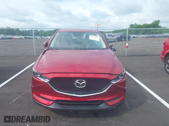 2019 Mazda CX-5 Sport with VIN JM3KFABM5K0627087, listed as a IAAI auction lot 42163866 with 38,050 mi miles and . Bid and sale history available at DreamBid. Image 12.