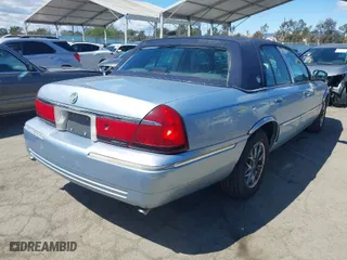 1999 Mercury Grand Marquis LS with VIN 2MEFM75WXXX629568, listed as a IAAI auction lot 41937347 with 166,100 mi miles. Bid and sale history available at carsss.com. Image 4.