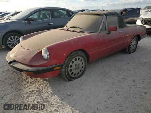 1990 Alfa Romeo Spider z VIN ZARBA12G6L6001683, wystawiony jako Copart lot #75611344 z przebiegiem 59 515 mil mil oraz Szkoda całkowita • Salvage title. Historia ofert i sprzedaży dostępna na DreamBid. Obrazek 1.