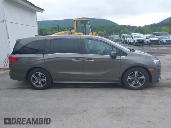 2018 Honda Odyssey Touring with VIN 5FNRL6H89JB057148, listed as a IAAI auction lot 42511909 with 166,438 mi miles and . Bid and sale history available at DreamBid. Image 13.