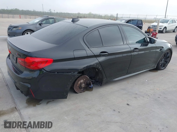 2019 BMW M5 z VIN WBSJF0C51KB447804, wystawiony jako IAAI lot #41848760 z przebiegiem 83 303 mil mil oraz . Historia ofert i sprzedaży dostępna na DreamBid. Obrazek 4.