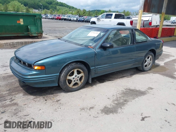 1997 Oldsmobile Cutlass Supreme S z VIN 1G3WH12M9VF317272, wystawiony jako IAAI lot #42346360 z przebiegiem 156 553 mil mil oraz . Historia ofert i sprzedaży dostępna na DreamBid. Obrazek 2.