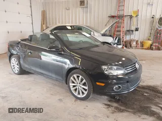 2012 Volkswagen Eos Komfort z VIN WVWBW7AH4CV002233, wystawiony jako IAAI lot #42591696 z przebiegiem 123 353 mil mil oraz . Historia ofert i sprzedaży dostępna na DreamBid. Obrazek 1.