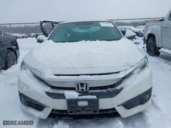 2016 Honda Civic Coupe Touring with VIN 2HGFC3B91GH351389, listed as a IAAI auction lot 41612467 with 78,934 mi miles. Bid and sale history available at carsss.com. Image 12.