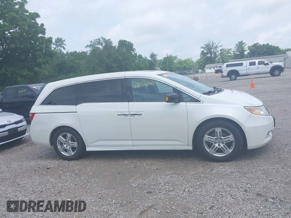 2013 Honda Odyssey Touring with VIN 5FNRL5H9XDB049390, listed as a IAAI auction lot 42532861 with 129,376 mi miles and . Bid and sale history available at DreamBid. Image 14.