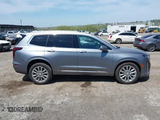 2022 Cadillac XT6 Premium Luxury z VIN 1GYKPDRS4NZ146284, wystawiony jako IAAI lot #42150678 z przebiegiem 28 890 mil mil oraz . Historia ofert i sprzedaży dostępna na DreamBid. Obrazek 14.