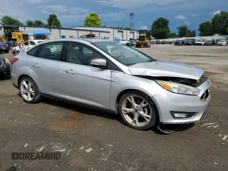2015 Ford Focus Titanium with VIN 1FADP3J27FL285842, listed as a Copart auction lot 61159935 with 79,215 mi miles and Salvage title. Bid and sale history available at DreamBid. Image 4.