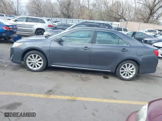 2012 Toyota Camry Hybrid XLE with VIN 4T1BD1FK9CU059021, listed as a IAAI auction lot 41932696 with 194,292 mi miles. Bid and sale history available at carsss.com. Image 14.