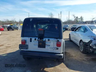 2004 Jeep Wrangler Sport Right Hand Drive with VIN 1J4F449SX4P780560, listed as a IAAI auction lot 41645721 with 146,681 mi miles. Bid and sale history available at carsss.com. Image 16.