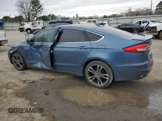 2019 Ford Fusion Titanium with VIN 3FA6P0D99KR117213, listed as a Copart auction lot 46450585 with 128,868 mi miles and Salvage Title. Bid and sale history available at carsss.com. Image 2.