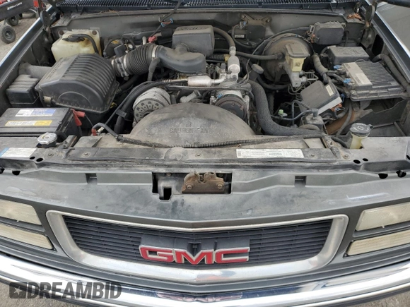 1999 GMC Suburban z VIN 1GKFK16R0XJ772880, wystawiony jako Copart lot #46986325 z przebiegiem 237 921 mil mil oraz Czysty tytuł • Clean title. Historia ofert i sprzedaży dostępna na DreamBid. Obrazek 12.
