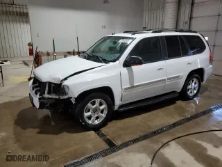 2005 GMC Envoy SLE with VIN 1GKDT13S452315816, listed as a Copart auction lot 52863805 with 128,922 mi miles and Salvage Title. Bid and sale history available at carsss.com. Image 1.
