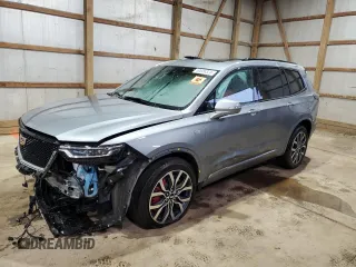 2023 Cadillac XT6 AWD Sport with VIN 1GYKPGRS5PZ121334, listed as a Copart auction lot 50606324 with 10,455 mi miles and Salvage Title. Bid and sale history available at carsss.com. Image 1.