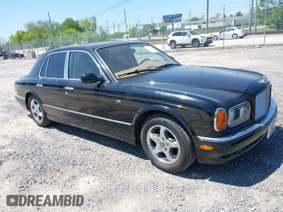 1999 Bentley Arnage z VIN SCBLB51E1XCX01401, wystawiony jako IAAI lot #42133144 z przebiegiem 29 699 mil mil oraz . Historia ofert i sprzedaży dostępna na DreamBid. Obrazek 1.