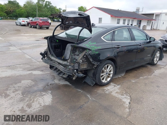 2019 Ford Fusion Hybrid SEL with VIN 3FA6P0MU1KR202860, listed as a IAAI auction lot 41983299 with 133,671 mi miles. Bid and sale history available at carsss.com. Image 4.
