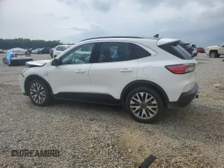 2020 Ford Escape Titanium z VIN 1FMCU9J9XLUB57675, wystawiony jako Copart lot #57777795 z przebiegiem Nie podano mil oraz Szkoda całkowita • Salvage title. Historia ofert i sprzedaży dostępna na DreamBid. Obrazek 2.