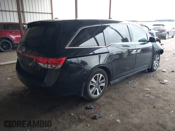 2014 Honda Odyssey Touring with VIN 5FNRL5H98EB095835, listed as a IAAI auction lot 42153412 with 124,131 mi miles and . Bid and sale history available at DreamBid. Image 4.