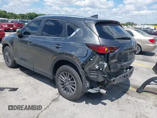 2020 Mazda CX-5 Touring with VIN JM3KFACM9L0826742, listed as a IAAI auction lot 41903755 with 73,409 mi miles and . Bid and sale history available at DreamBid. Image 3.