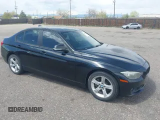 2014 BMW 3 Series 328i xDrive with VIN WBA3B3C56EJ981322, listed as a IAAI auction lot 42104530 with 104,376 mi miles. Bid and sale history available at carsss.com. Image 1.