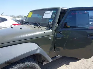 2015 Jeep Wrangler Sport with VIN 1C4AJWAGXFL650428, listed as a IAAI auction lot 42010629 with 80,039 mi miles. Bid and sale history available at carsss.com. Image 6.