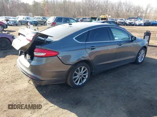2017 Ford Fusion SE z VIN 3FA6P0HDXHR321008, wystawiony jako IAAI lot #41620779 z przebiegiem 110 116 mil mil oraz . Historia ofert i sprzedaży dostępna na DreamBid. Obrazek 4.