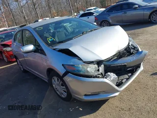 2010 Honda Insight LX z VIN JHMZE2H52AS021621, wystawiony jako IAAI lot #41375852 z przebiegiem 214 635 mil mil oraz . Historia ofert i sprzedaży dostępna na DreamBid. Obrazek 1.