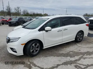 2020 Honda Odyssey Touring with VIN 5FNRL6H8XLB019365, listed as a Copart auction lot 52404335 with 59,486 mi miles and Salvage Title. Bid and sale history available at DreamBid. Image 1.