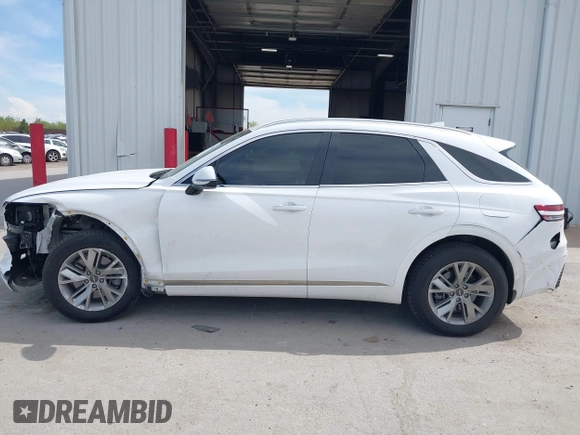 2022 Genesis GV70 2.5T with VIN KMUMADTB0NU043317, listed as a IAAI auction lot 42222034 with 30,566 mi miles and . Bid and sale history available at DreamBid. Image 15.